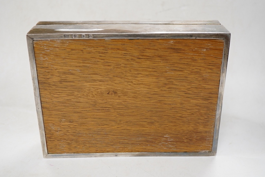 A George V silver mounted rectangular cigarette box, Sampson Mordan & Co, London, 1931, 17cm, with engraved monogram to the cover.